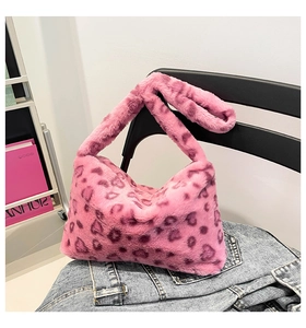 Close-up of plush pink leopard print shoulder bag with soft faux fur texture detail