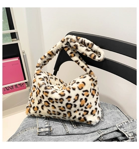 Detail of plush leopard print faux fur hobo bag showing soft texture and handle