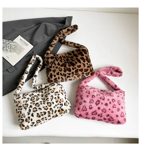 Three leopard print plush shoulder bags in brown, beige, and pink colors displayed on white