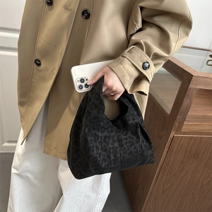 Minimalist black leopard print tote bag with soft suede texture for women's daily commute