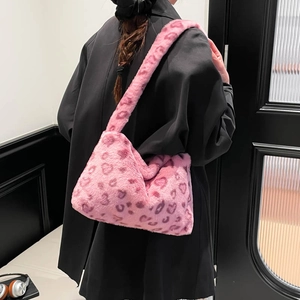 Stylish pink leopard and heart print faux fur shoulder bag with plush fluffy texture
