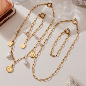 Vintage stainless steel jewelry set with gold coin pendants and baroque pearls