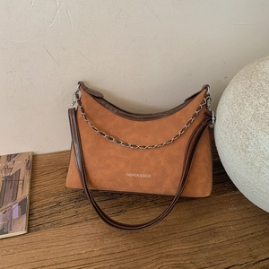 Brown faux suede half-moon crossbody bag with metal chain and fashion text detail