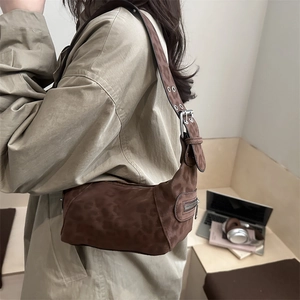 Fashionable leopard print hobo shoulder bag with adjustable strap and silver hardware
