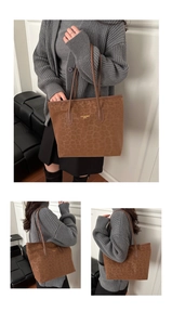 Detail of a large leopard print tote bag with gold lettering and slim shoulder straps