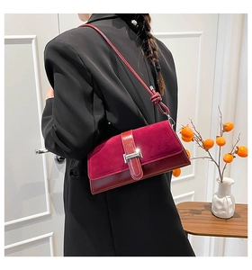Retro deep red hobo bag with suede leather patchwork and silver buckle on model