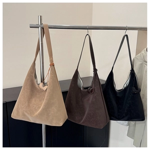 Three minimalist large capacity tote bags in khaki brown and black leather finishes