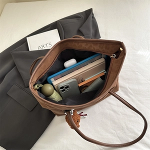 Retro brown large capacity tote bag shown with books and tablet for daily commute