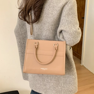 Chic light brown PU leather crossbody tote bag with top handles and fashion lettering