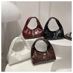 Detailed display of hobo bags in burgundy, black, white, and brown with glossy finish