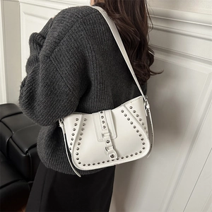 White rivet studded half-moon shoulder bag in smooth faux leather for women