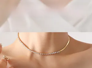 Close-up of gold blade chain necklace with pave-set cubic zirconia on a female model