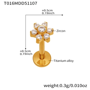 Macro shot of titanium alloy flower labret with seven zircon stones in golden finish