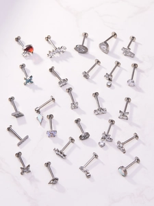 Collection of titanium lip rings with silver finish and zircon stone inlays