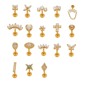 Set of 18 golden titanium labret studs with zircon and opal in diverse designs