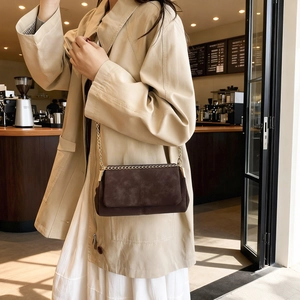 Deep coffee chain shoulder bag with cross-stitch design and gold chain strap