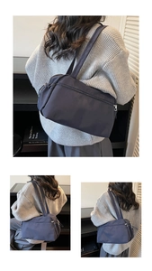 Detailed views of a water-resistant nylon tote bag with multiple compartments and zippers