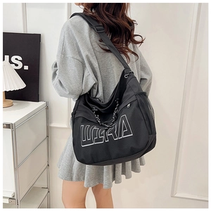 Detailed back view of a black large-capacity tote bag with white ULTRA print and side mesh pocket