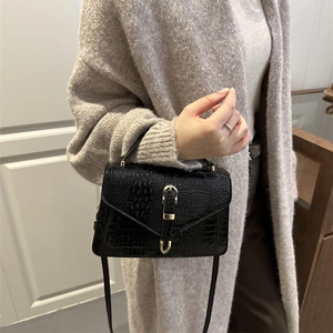 Fashionable black crocodile embossed crossbody bag for women with gold metal buckle