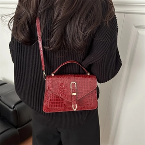 Burgundy crocodile pattern crossbody handbag for women with gold metal buckle
