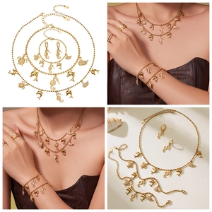 Marine themed 18k gold plated jewelry set with starfish and dolphin zircon pendants