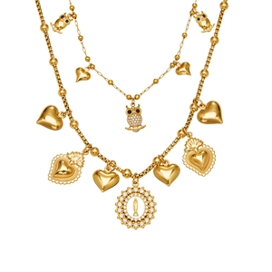 Double-layered gold necklace set with owl charms, heart pendants and a religious coin medallion
