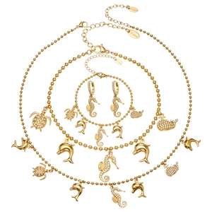 Gold-plated stainless steel jewelry set with ocean charms and sparkling zircon crystals