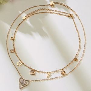 Double-layered 18k gold plated necklace with heart pendants and sparkling zircon accents
