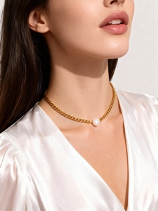Close-up of 18K gold plated chunky chain necklace with a single round white pearl pendant