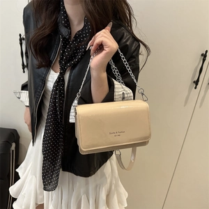 Elegant cream beige patent leather crossbody bag with silver chain strap for women
