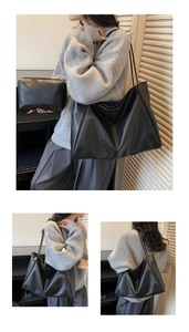 Detail of black textured PU leather tote bag set with matching inner pouch and slim straps