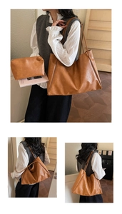 Detail view of large brown vintage tote bag with matching inner pouch and thin straps