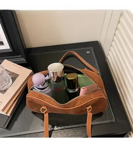 Interior view showing the large storage capacity of the brown suede hobo bag