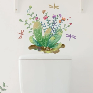 Macro detail of botanical wall stickers with green succulents and dragonflies on a white wall