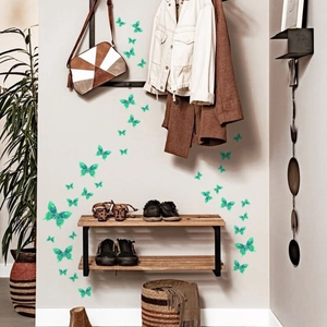 Luminous green butterfly wall stickers with glitter texture in a real home entryway setup