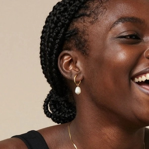 Minimalist 18K gold plated hoop earrings with natural freshwater pearl pendant on model