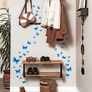 Detailed 3D blue butterfly wall decals with geometric textures on home entryway wall
