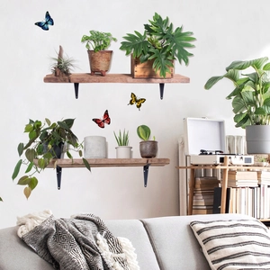 Close-up of dual-layer natural wood floating shelves with black metal L-shaped brackets