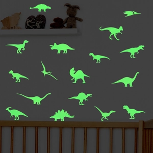 Luminous dinosaur wall stickers glowing in the dark for a cozy children's bedroom decor