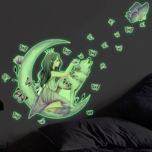 Luminous wall stickers showing a glowing fairy on the moon with wolves and butterflies