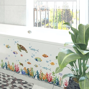 Detailed view of watercolor sea turtle and coral stickers on a white bathtub