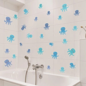 Detailed view of colorful cartoon octopus wall stickers applied to white bathroom tiles