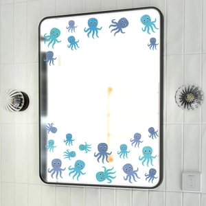 Detailed view of blue and purple cartoon octopus wall stickers on a bathroom mirror