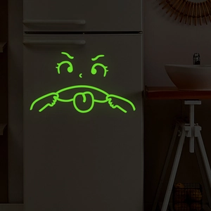 Luminous green emoji wall sticker with a funny tongue-out design for home decor