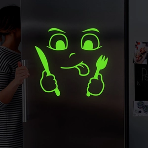 Luminous emoji fridge sticker with fork and knife design glowing in the dark