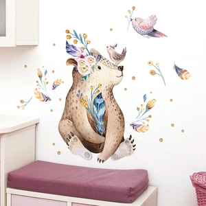 Detail of a watercolor bear wall sticker with floral wreath and birds for nursery decor