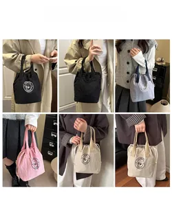 Lifestyle view showing models carrying waterproof nylon drawstring bucket bags in various colors