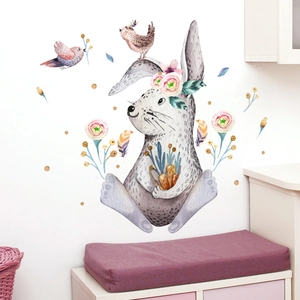 Watercolor rabbit wall decal with flowers and birds in a cozy room setting