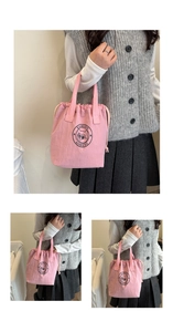 Detailed view of pink waterproof drawstring tote lunch bag with fashion cat logo