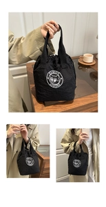 Close-up of black nylon bucket bag with fashion drawstring and cartoon cat logo detail
